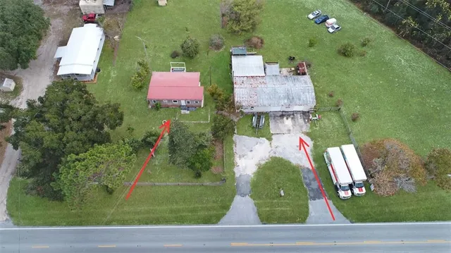 a view of a house with a big yard