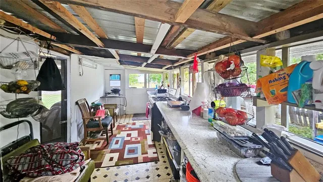 a view of a house with a big yard and large trees