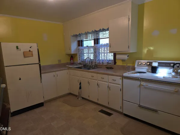 a kitchen with a sink and cabinets