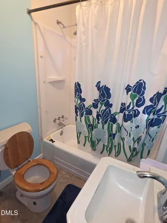 a bathroom with a toilet a sink and a bathtub