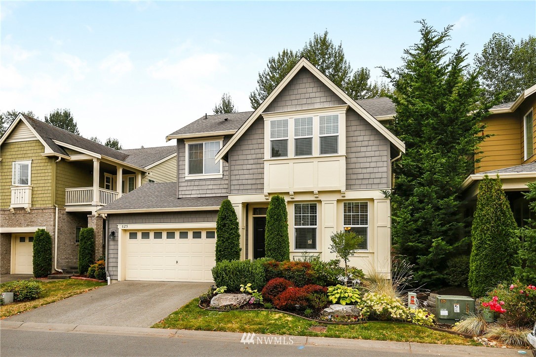 625 Kitsap Avenue Northeast Renton, WA 98059 - Photo 25 of 25 a front view of a house with a yard and garage