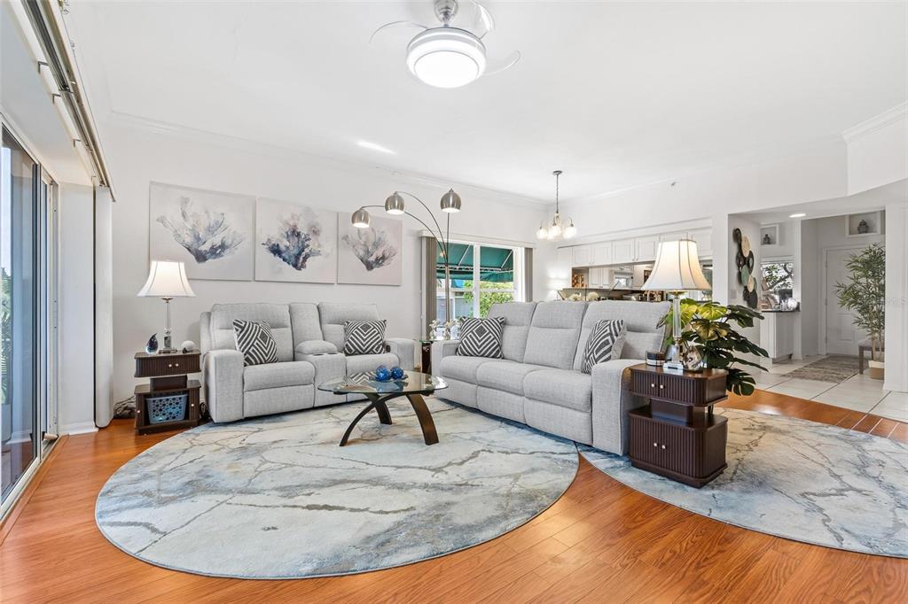 6555 99th Way North, Unit 20F St. Petersburg, FL 33708 - Photo 13 of 36 a living room with furniture and a wooden floor
