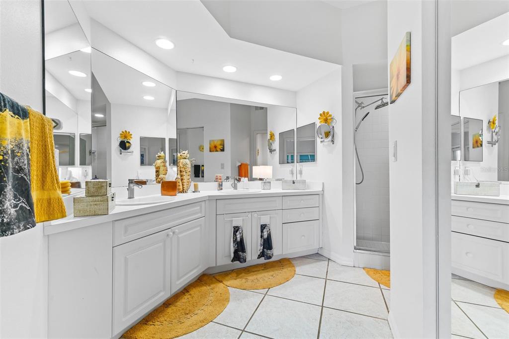 6555 99th Way North, Unit 20F St. Petersburg, FL 33708 - Photo 19 of 36 a large kitchen with stainless steel appliances a refrigerator and a stove top oven