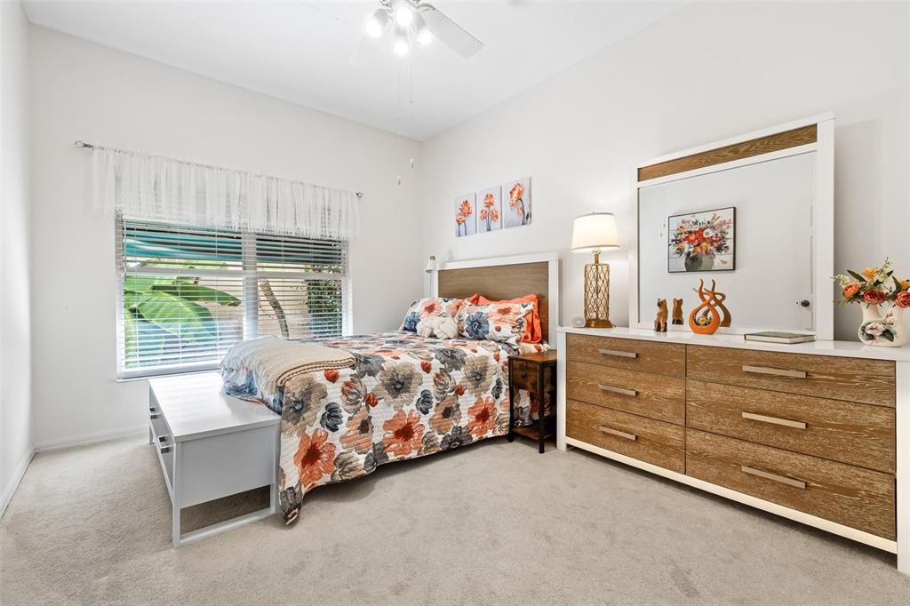 6555 99th Way North, Unit 20F St. Petersburg, FL 33708 - Photo 25 of 36 a bedroom with a bed and a window