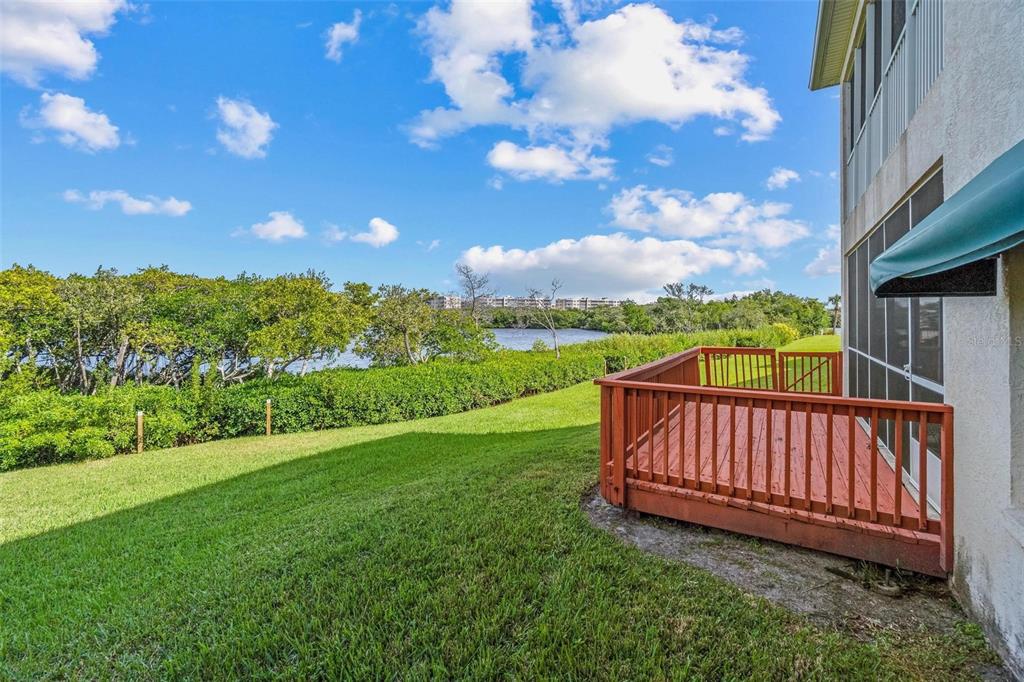 6555 99th Way North, Unit 20F St. Petersburg, FL 33708 - Photo 32 of 36 a view of a yard with a garden