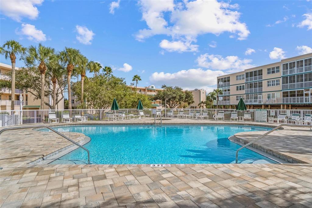 6555 99th Way North, Unit 20F St. Petersburg, FL 33708 - Photo 33 of 36 a view of swimming pool and outdoor space