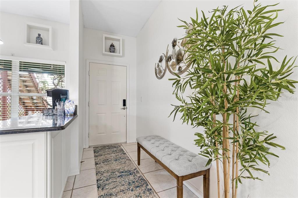 6555 99th Way North, Unit 20F St. Petersburg, FL 33708 - Photo 7 of 36 a view of entryway with wooden floor