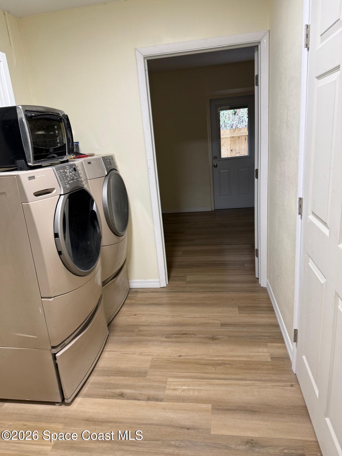 3785 Bird Street Cocoa, FL 32927 - Photo 13 of 15 a view of a hallway with washer and dryer
