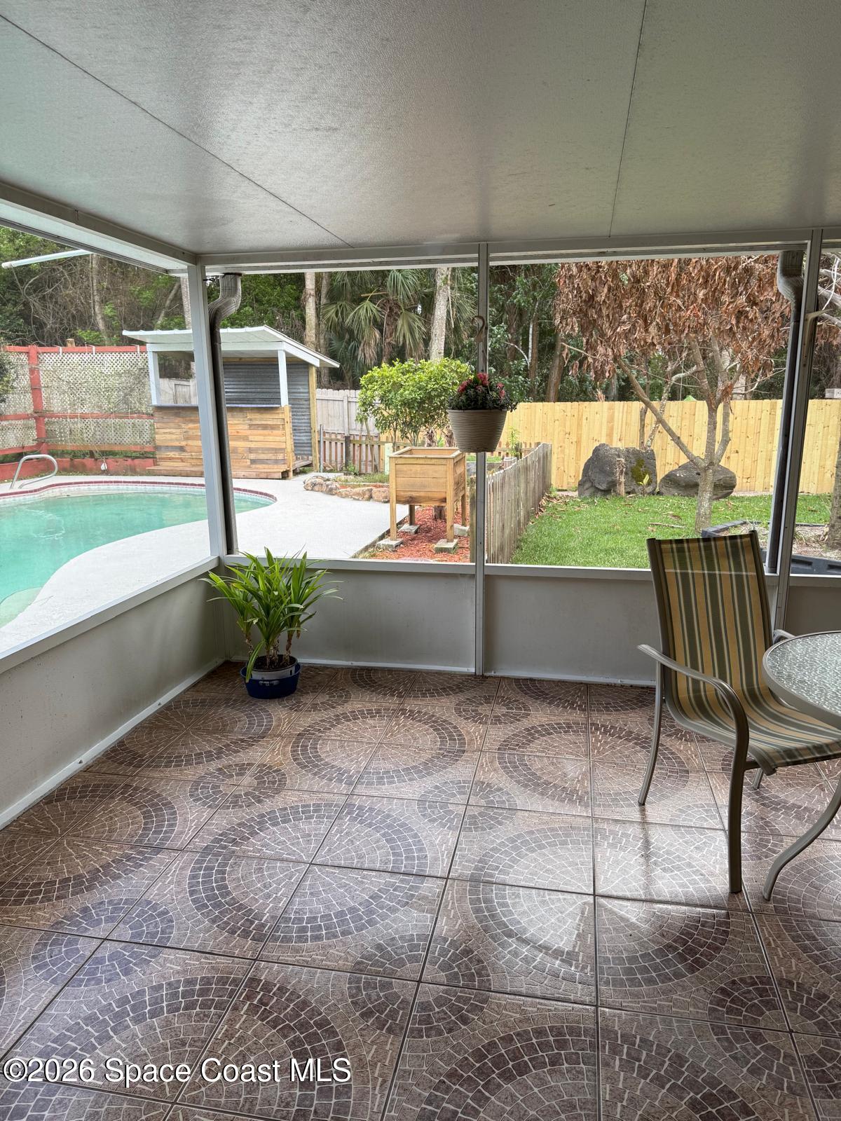 3785 Bird Street Cocoa, FL 32927 - Photo 14 of 15 a view of two chairs and table in the patio