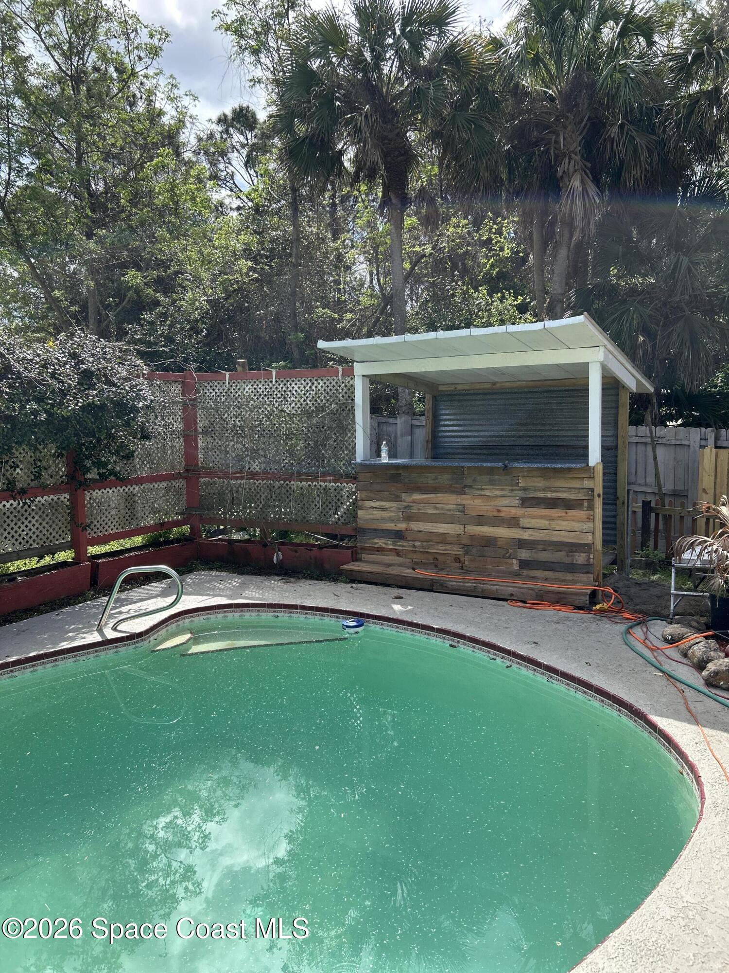 3785 Bird Street Cocoa, FL 32927 - Photo 6 of 15 a view of a backyard with swimming pool