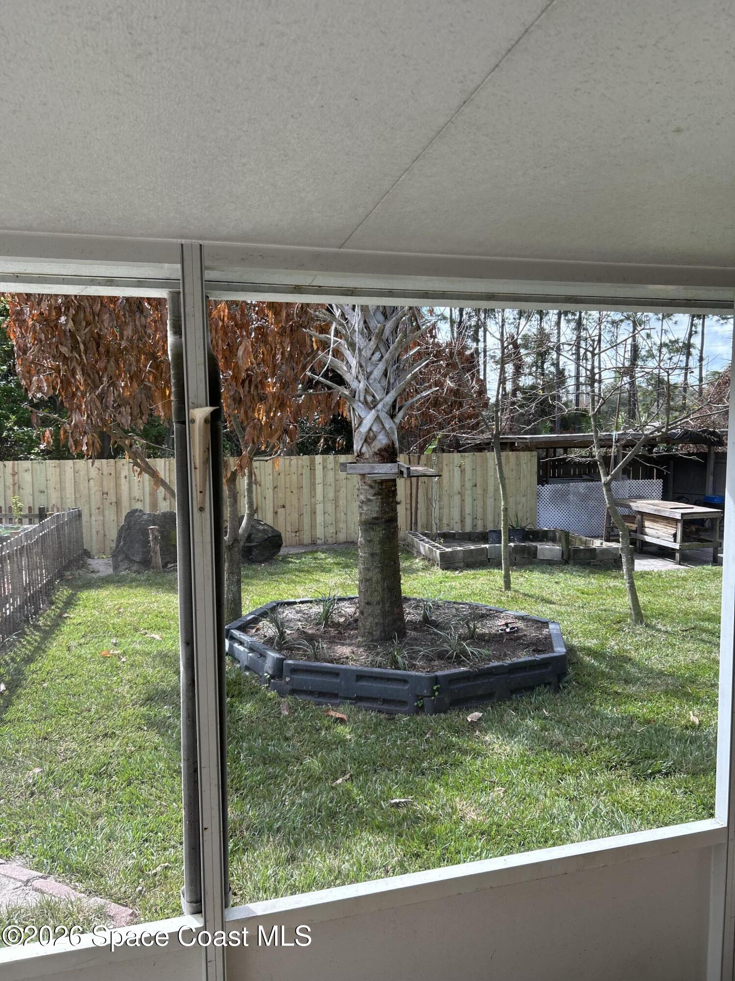 3785 Bird Street Cocoa, FL 32927 - Photo 7 of 15 a view of a backyard with porch