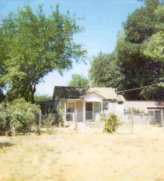 2724 Irwin Road, Unit 1 Redding, CA 96002 - Photo 1 of 1 a front view of a house with a yard covered with trees