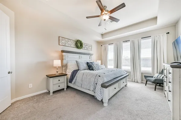 a en suite bathroom with a toilet sink and mirror