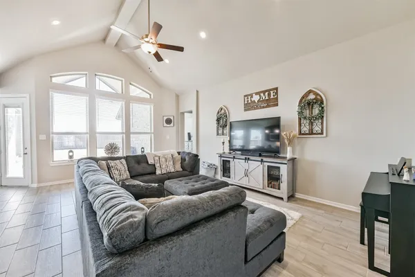 a living room with furniture and a large window