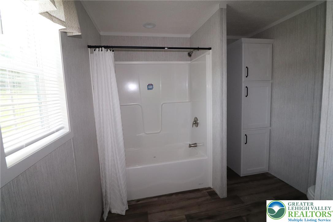 5020 Old Timber Road Stroudsburg, PA 18360 - Photo 17 of 32 a bathroom with a glass shower door