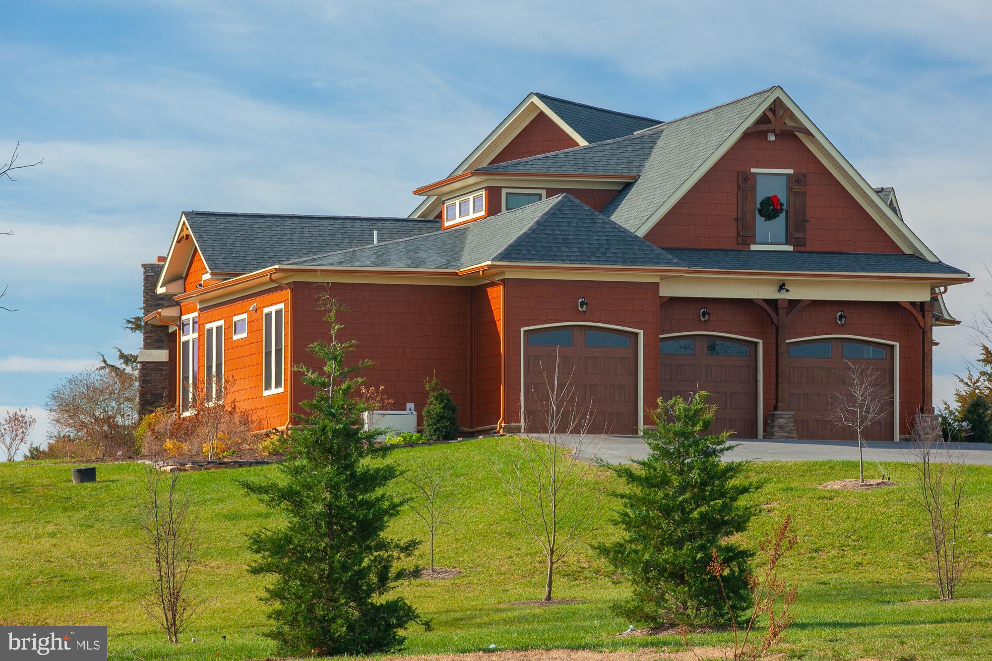 38 Whitings Neck Road, Unit POTOMAC OVERLOOK Martinsburg, WV 25404 - Photo 20 of 40 a front view of a house with garden