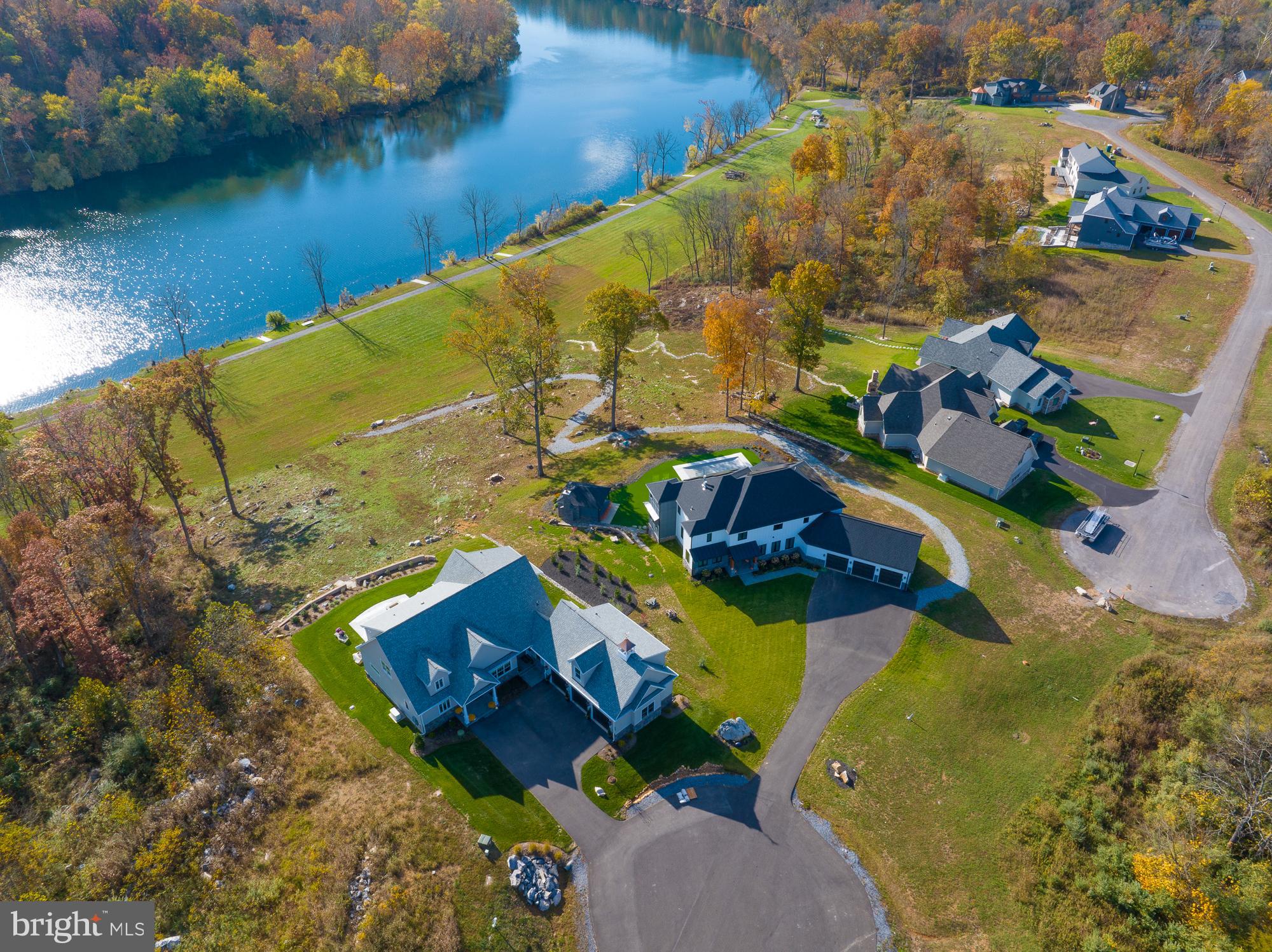 38 Whitings Neck Road, Unit POTOMAC OVERLOOK Martinsburg, WV 25404 - Photo 22 of 40 an aerial view of a house with a lake view