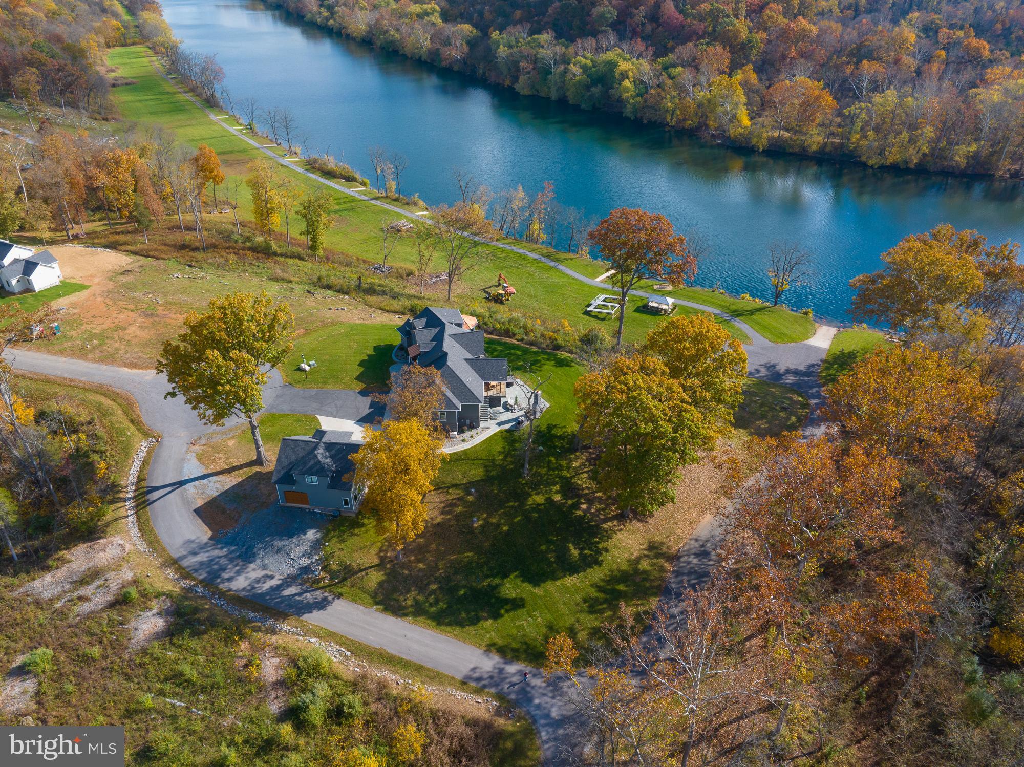 38 Whitings Neck Road, Unit POTOMAC OVERLOOK Martinsburg, WV 25404 - Photo 9 of 40 an aerial view of a house with a lake view
