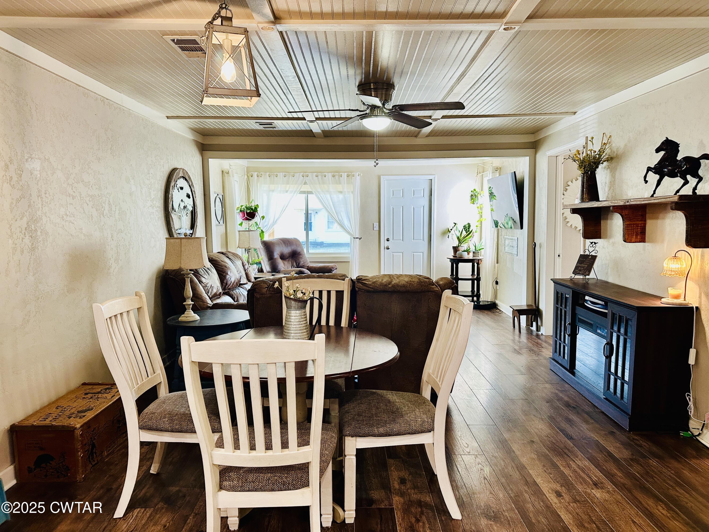 404 McKnight Street Rutherford, TN 38369 - Photo 12 of 33 a view of a dining room with furniture wooden floor and chandelier