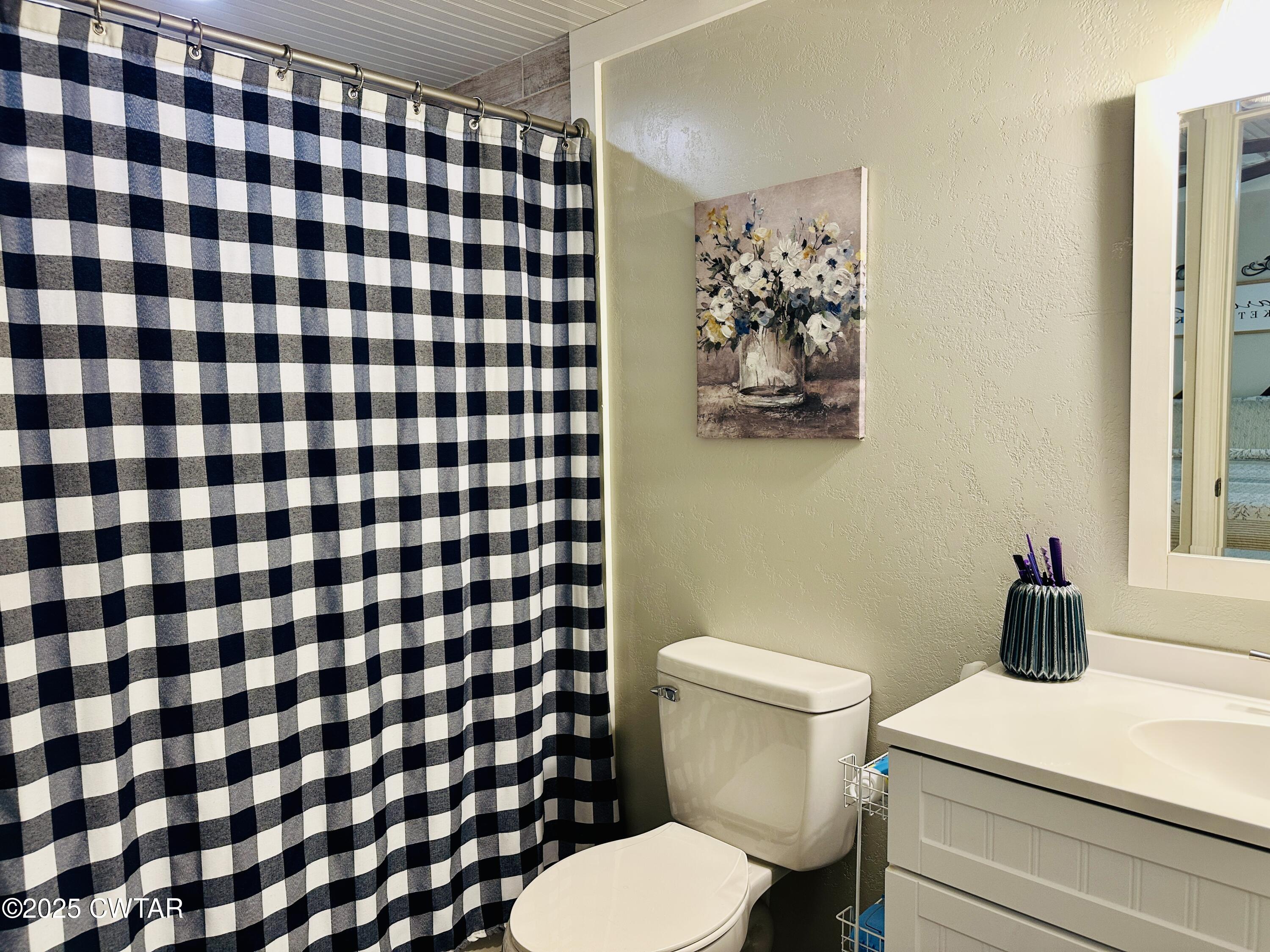 404 McKnight Street Rutherford, TN 38369 - Photo 22 of 33 a bathroom with a toilet and a shower