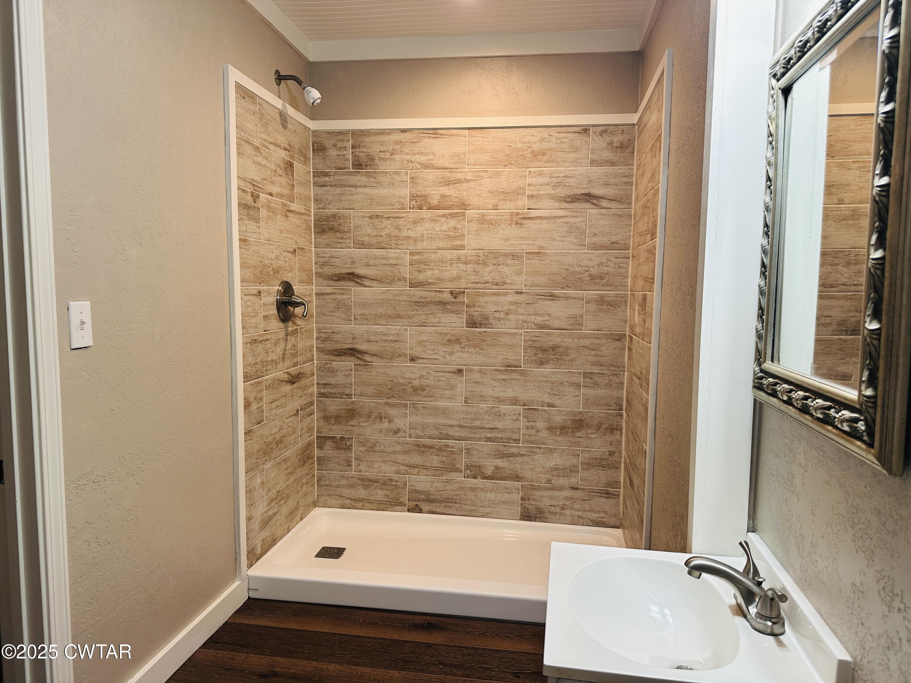 404 McKnight Street Rutherford, TN 38369 - Photo 33 of 33 a bathroom with a sink and a bathtub