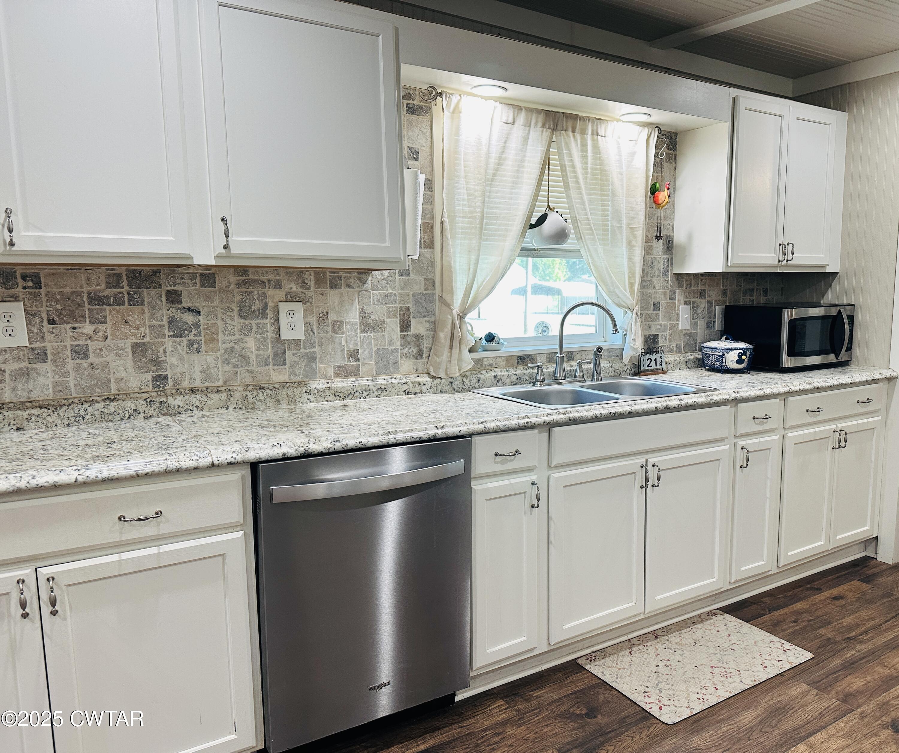 404 McKnight Street Rutherford, TN 38369 - Photo 10 of 33 a kitchen with granite countertop white cabinets and a window