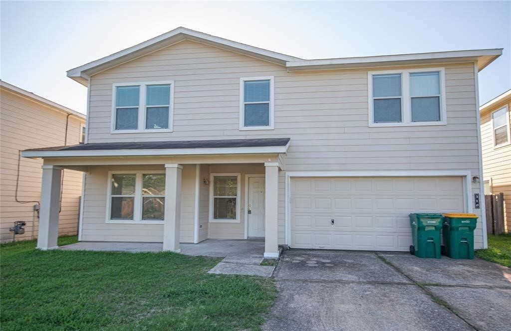310 Falling Pine Drive Conroe, TX 77304 - Photo 1 of 15 a view of a house with a yard and large parking space