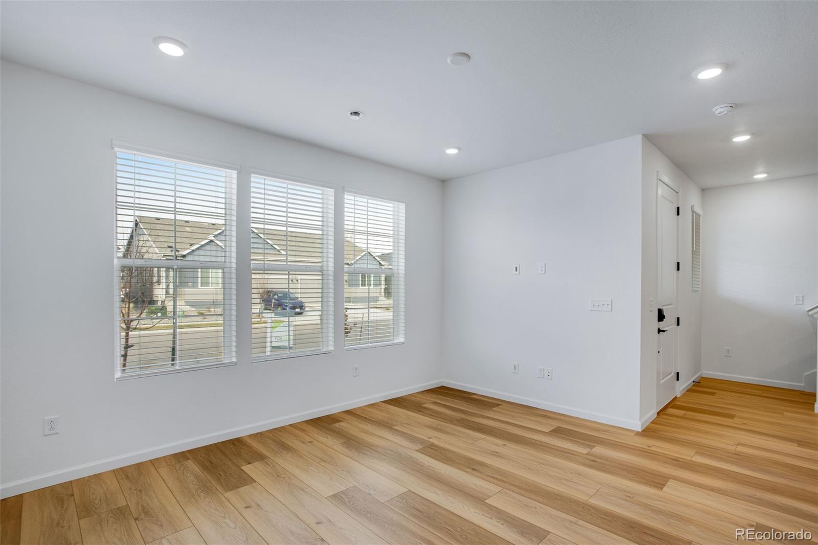 1765 Mount Meeker Avenue Berthoud, CO 80513 - Photo 12 of 37 a view of empty room with wooden floor and fan