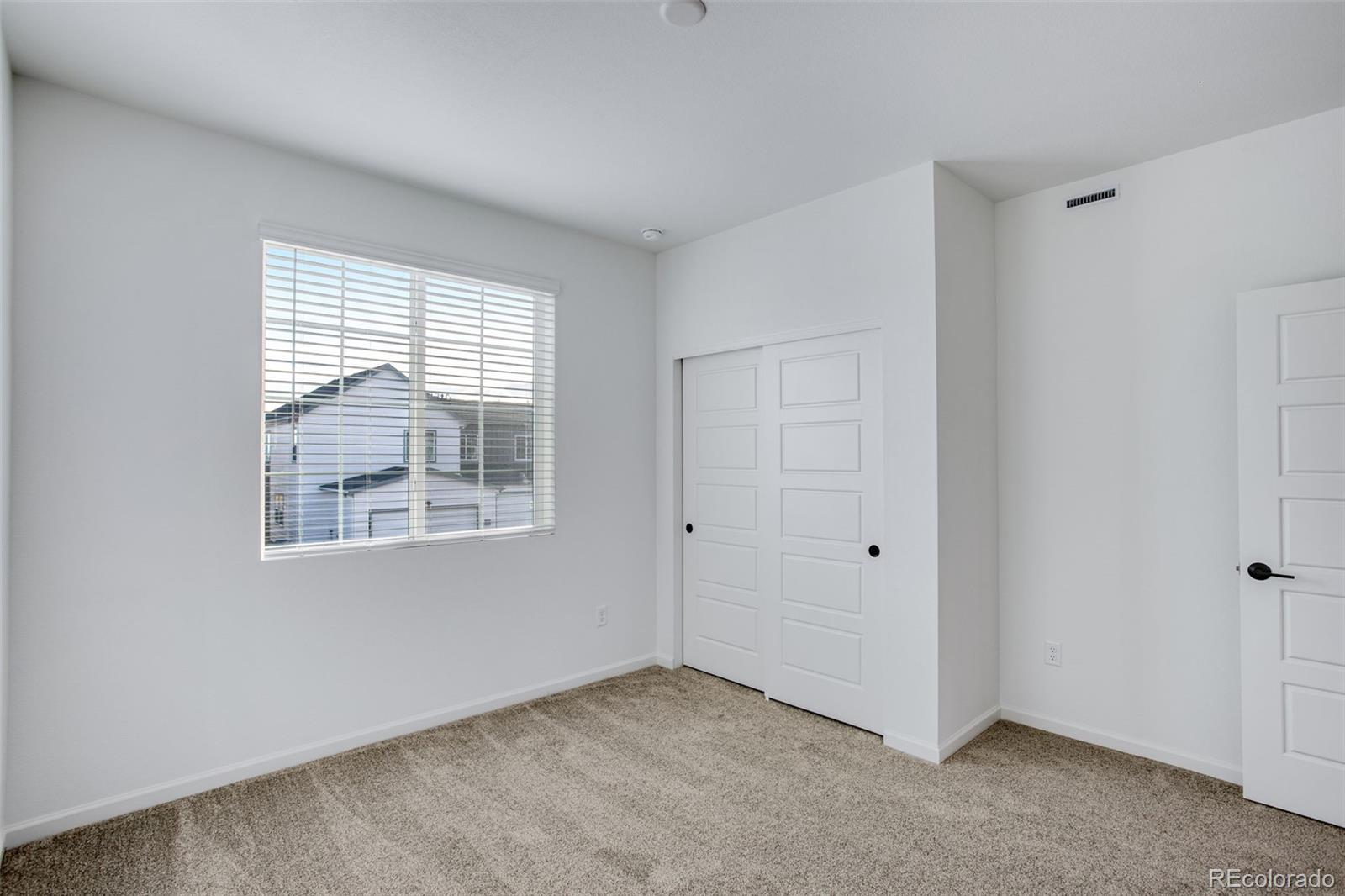 1765 Mount Meeker Avenue Berthoud, CO 80513 - Photo 24 of 37 a view of an empty room with a window