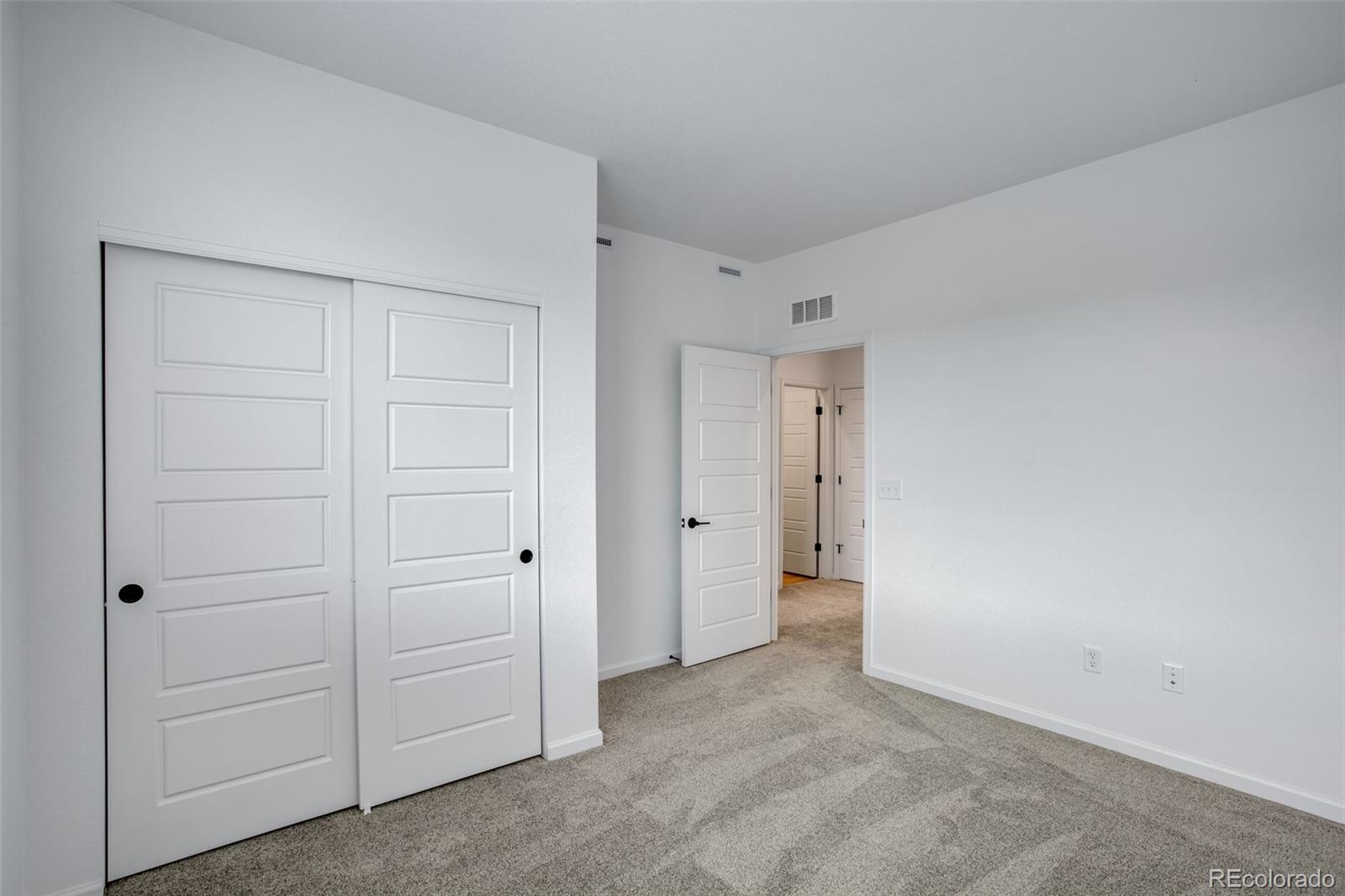 1765 Mount Meeker Avenue Berthoud, CO 80513 - Photo 25 of 37 an empty room with closet area