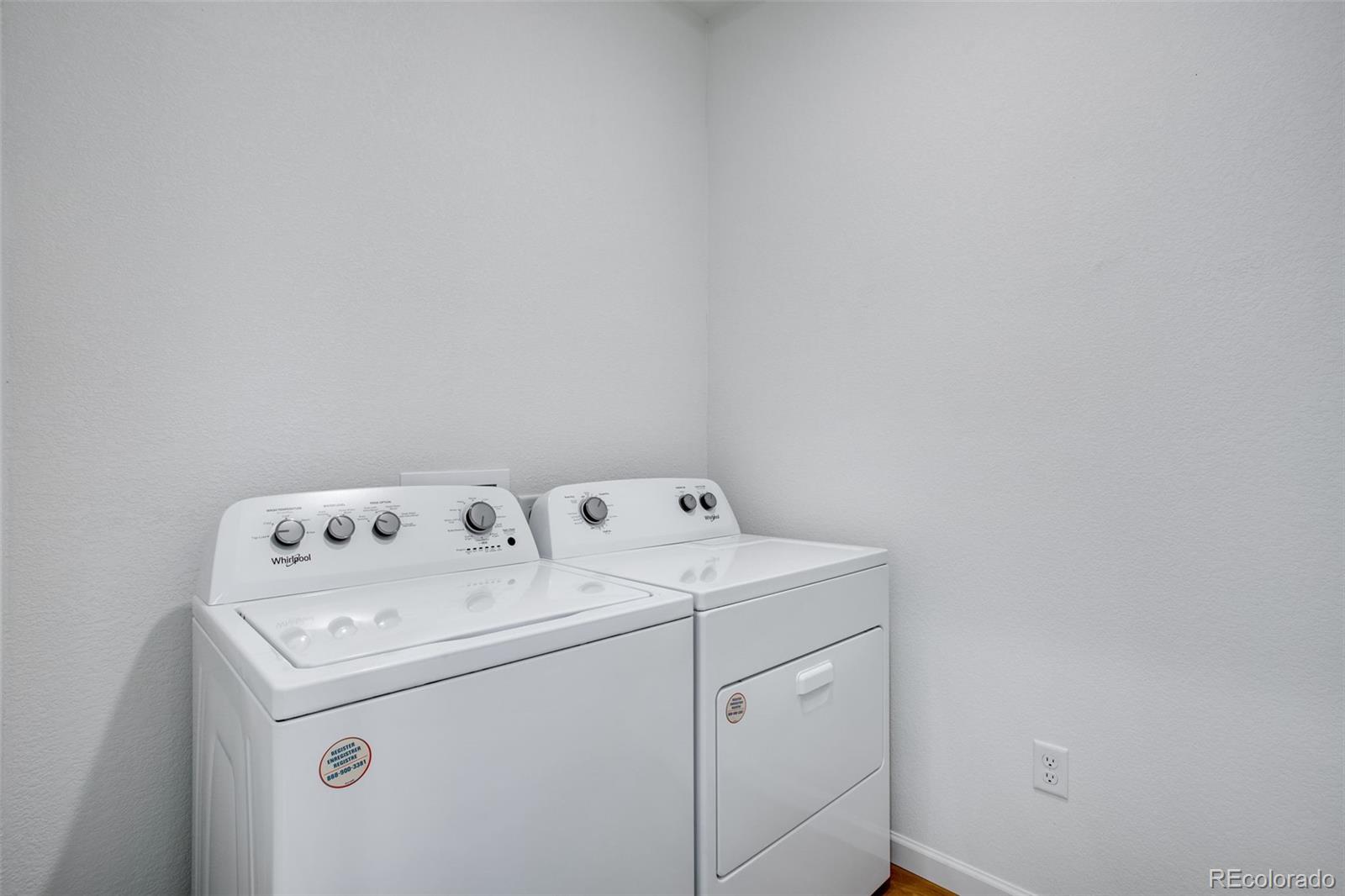 1765 Mount Meeker Avenue Berthoud, CO 80513 - Photo 26 of 37 a utility room with dryer and washer