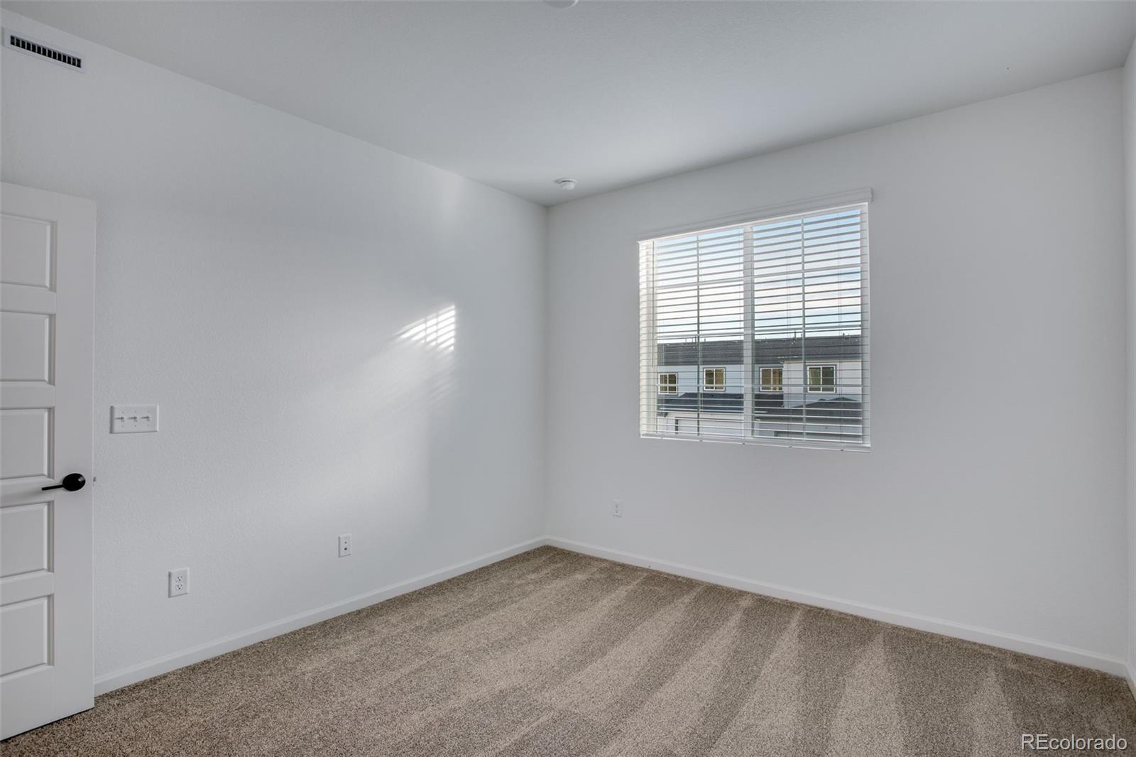1765 Mount Meeker Avenue Berthoud, CO 80513 - Photo 28 of 37 a view of an empty room with a window