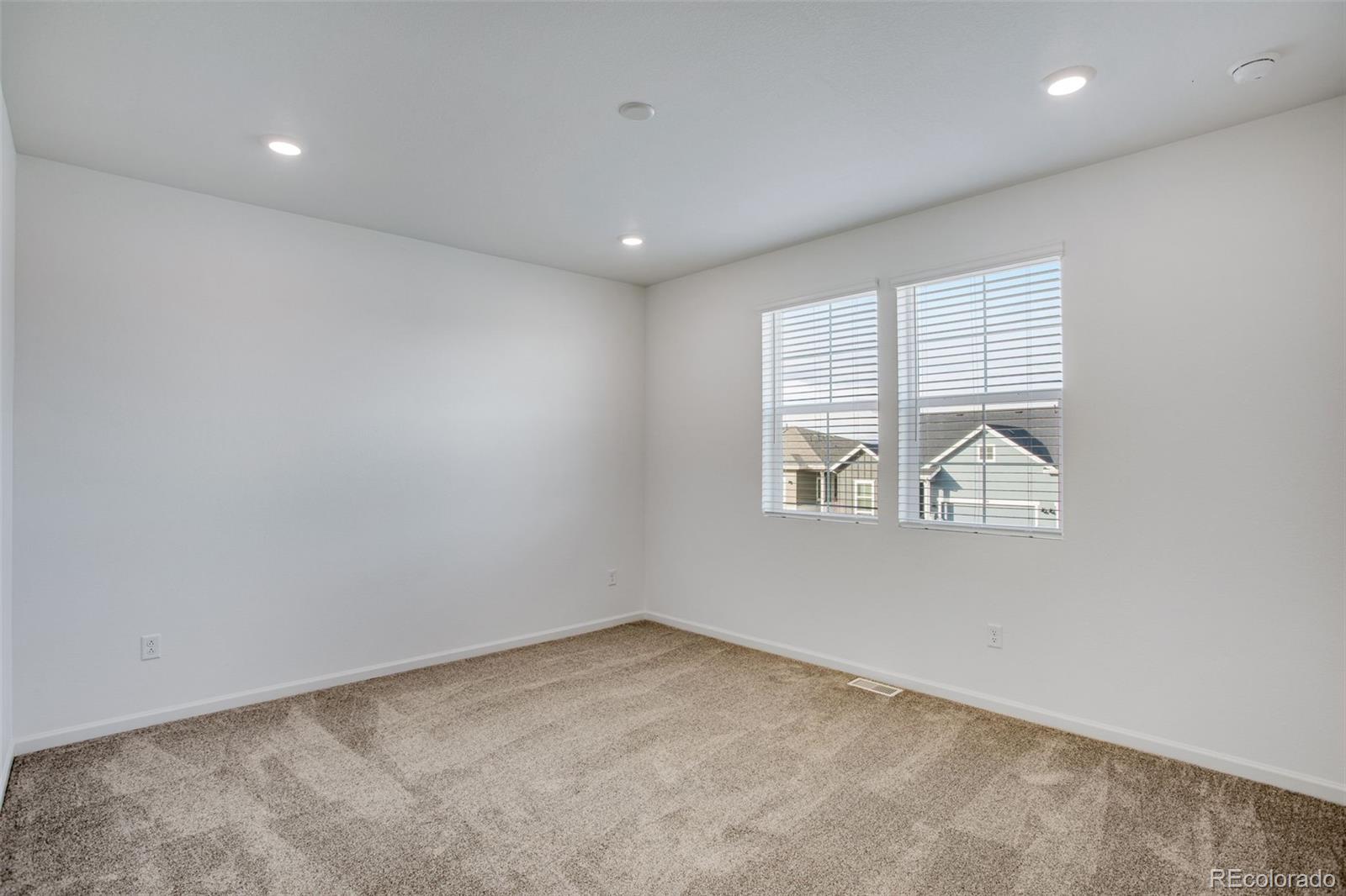 1765 Mount Meeker Avenue Berthoud, CO 80513 - Photo 31 of 37 an empty room with windows