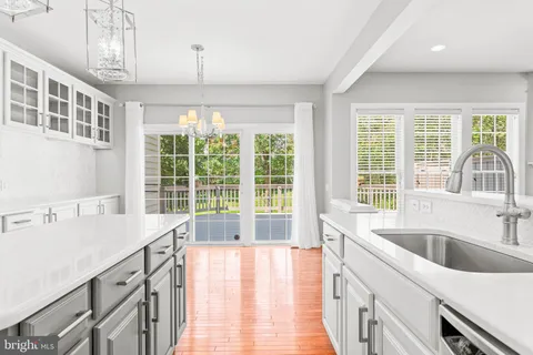 a kitchen with stainless steel appliances a sink stove and refrigerator