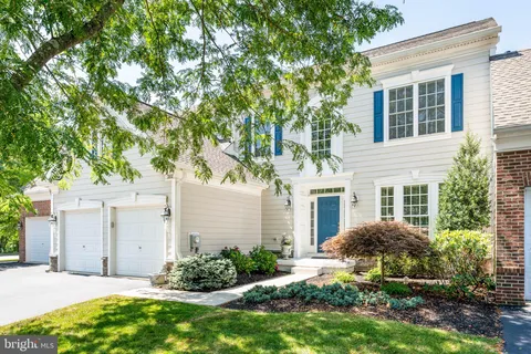 a view of a house with a yard and plants