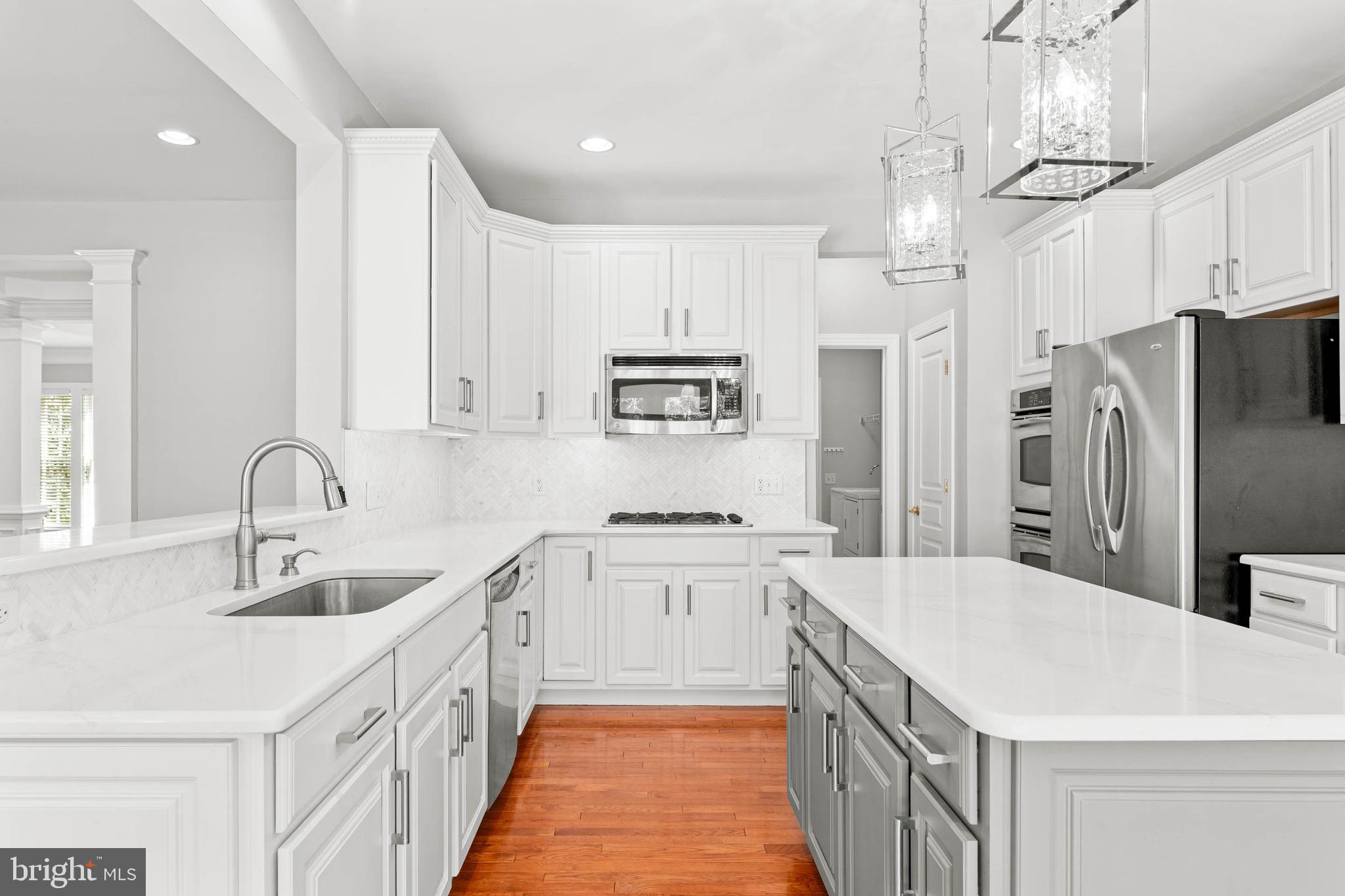 302 Arthur Court Newtown Square, PA 19073 - Photo 21 of 57 Kitchen w/ quartz counter tops.