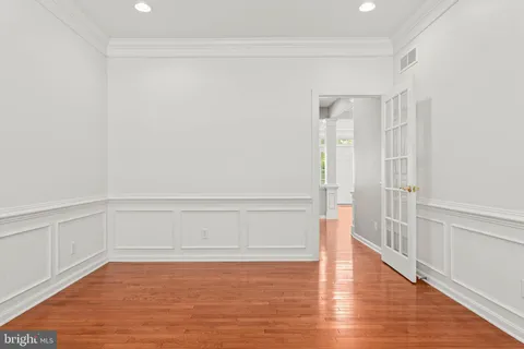 a bedroom with a bed and ceiling fan