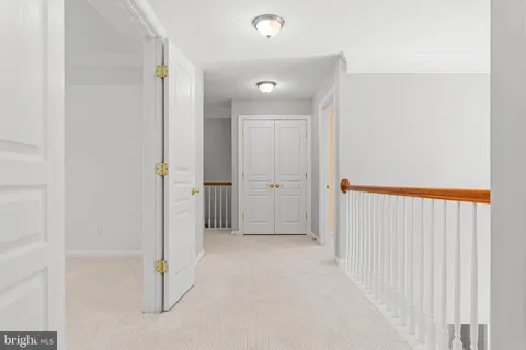 a living room with furniture a window and a fireplace