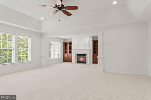 a bathroom with a granite countertop toilet a sink and shower