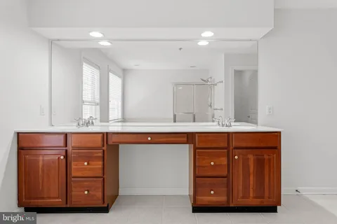 a room with a window and ceiling fan