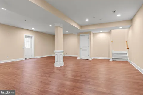 a view of a house with a yard and furniture