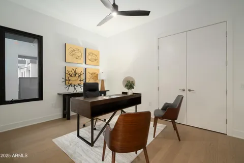 a view of a workspace with furniture