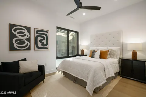 a bedroom with a bed and wall painting