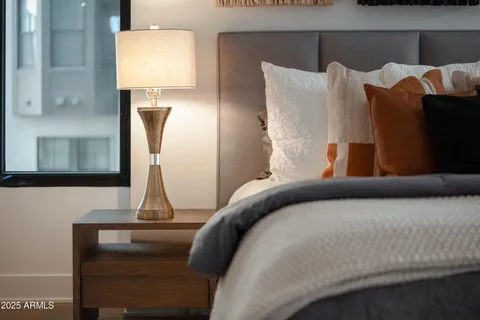 a bedroom with bed and window