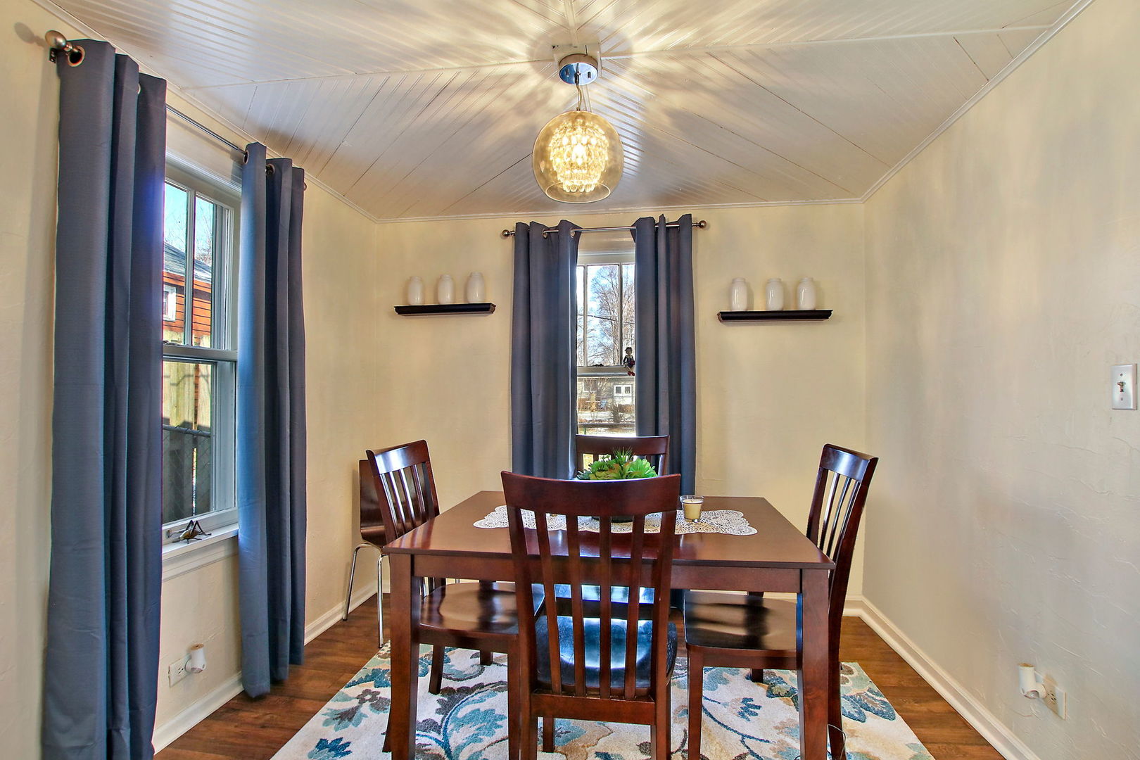 7608 Beaver Road Wonder Lake, IL 60097 - Photo 5 of 19 a view of a dining room with furniture and a chandelier