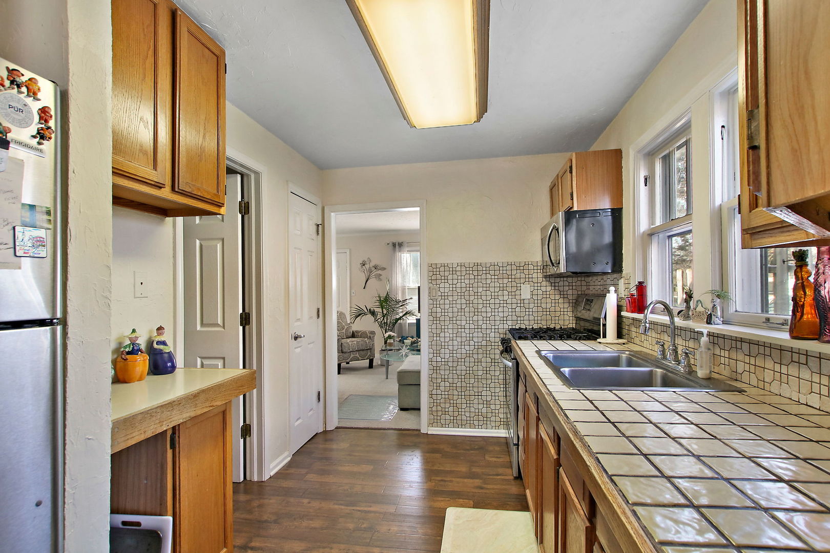 7608 Beaver Road Wonder Lake, IL 60097 - Photo 7 of 19 a kitchen with stainless steel appliances granite countertop a refrigerator and a stove top oven