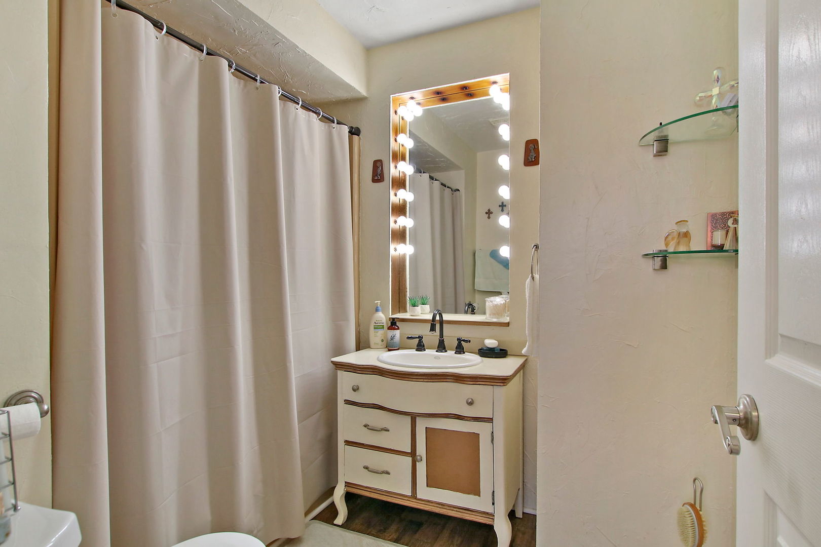 7608 Beaver Road Wonder Lake, IL 60097 - Photo 8 of 19 a bathroom with a sink vanity and a mirror