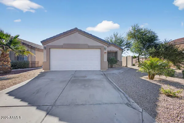 a view of a house with a yard and garage