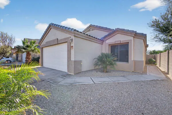 a view of a house with a yard and plants