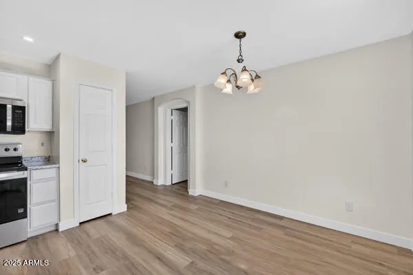 a view of a livingroom with wooden floor